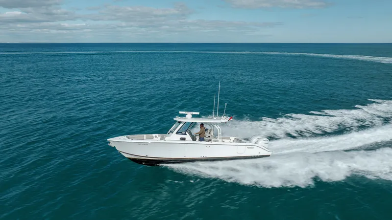 The Image of 2022 Pursuit S 328 boat cruising on open water. - 0