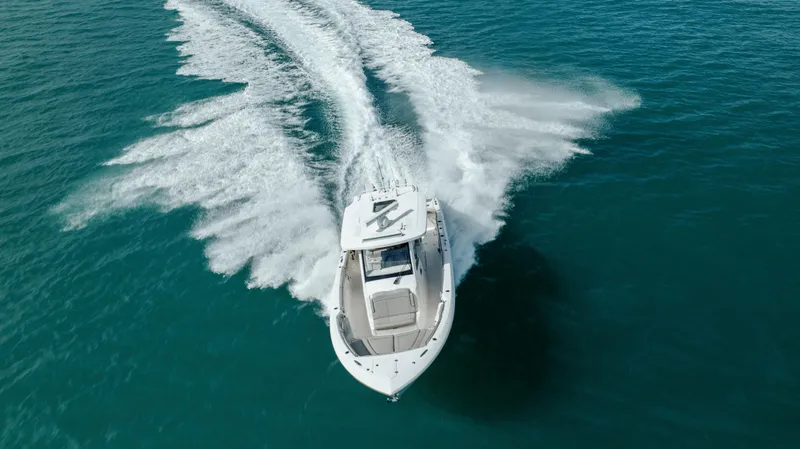 Slide: The Image of 2022 Pursuit S 328 boat cruising on open water. - 17