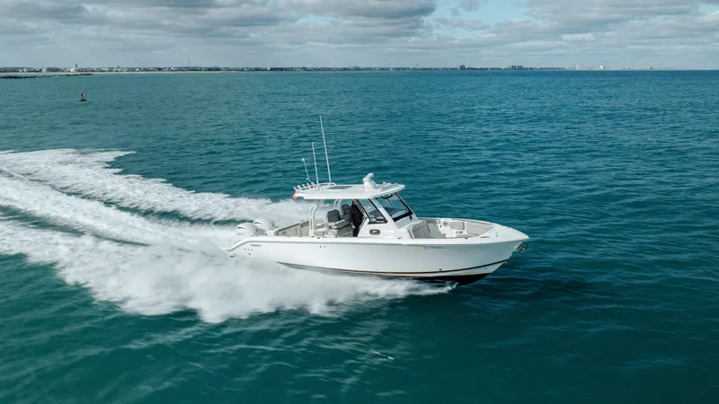 Slide: The Image of 2022 Pursuit S 328 boat cruising on open water. - 18