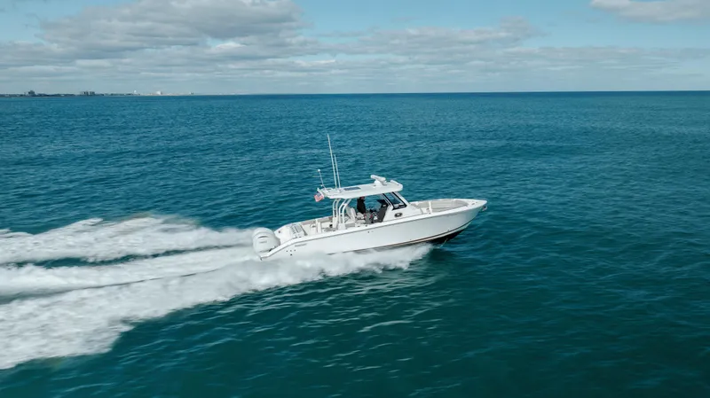 Slide: The Image of 2022 Pursuit S 328 boat cruising on open water. - 20