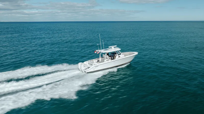 Slide: The Image of 2022 Pursuit S 328 boat cruising on open water. - 21