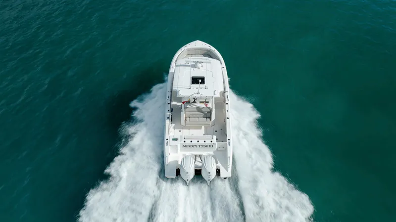 Slide: The Image of 2022 Pursuit S 328 boat cruising on open water. - 22