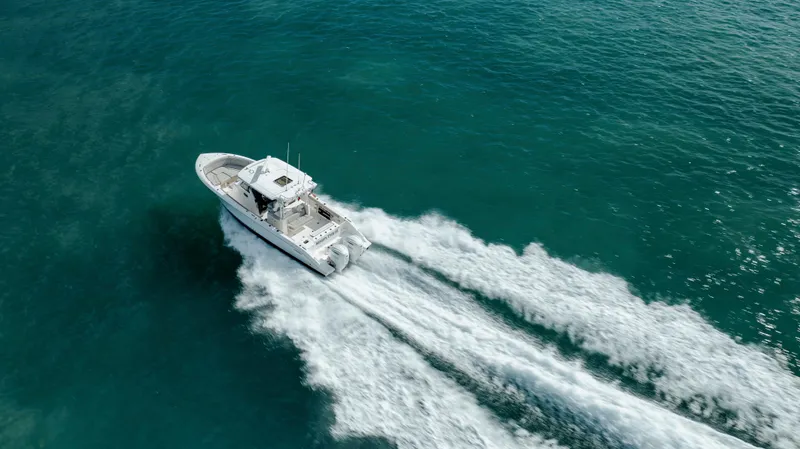 Slide: The Image of 2022 Pursuit S 328 boat cruising on open water. - 23
