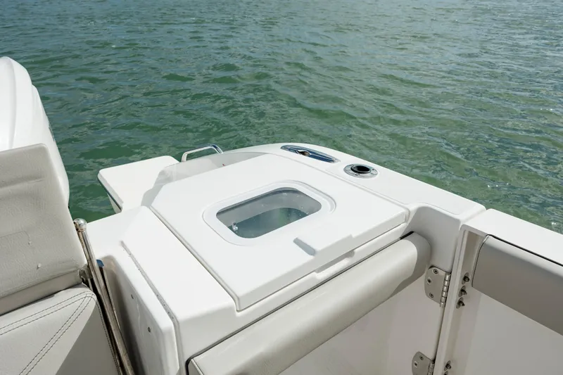 Slide: The Image of 2022 Pursuit S 328 boat stern with seating and storage compartment. - 32
