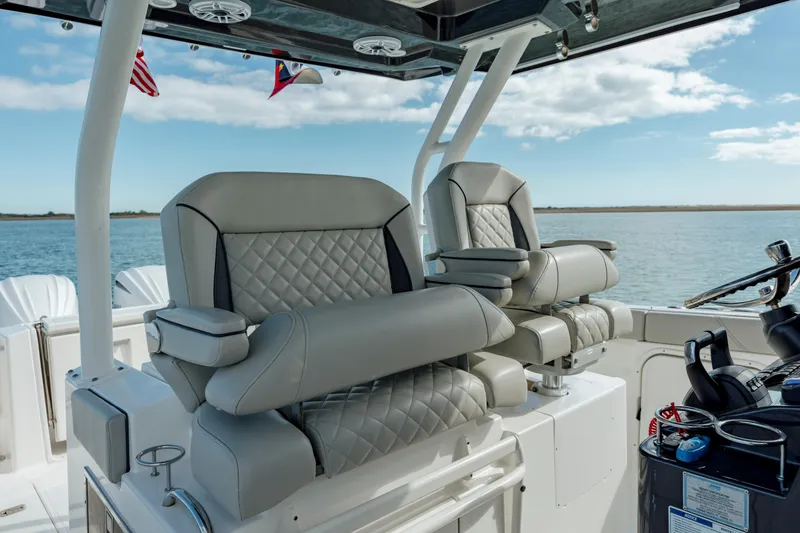 Slide: The Image of 2022 Pursuit S 328 boat with luxurious seating and ocean view. - 43