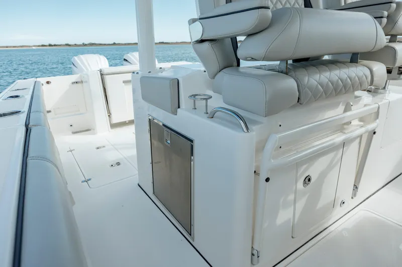 Slide: The Image of 2022 Pursuit S 328 boat interior with seating and storage compartments. - 44