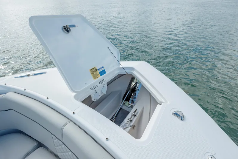 Slide: The Image of 2022 Pursuit S 328 boat with open storage compartment on deck. - 47
