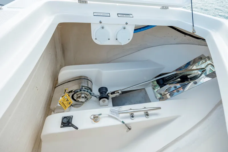Slide: The Image of 2022 Pursuit S 328 anchor locker with windlass and chain. - 48