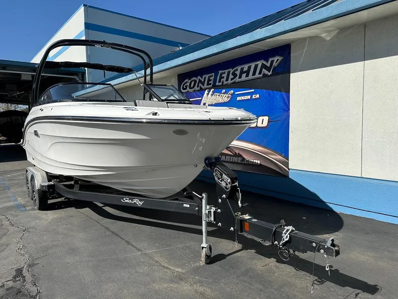 Slide: The Image of 2024 Sea Ray SPX 210 OB boat on trailer at dealership. - 1