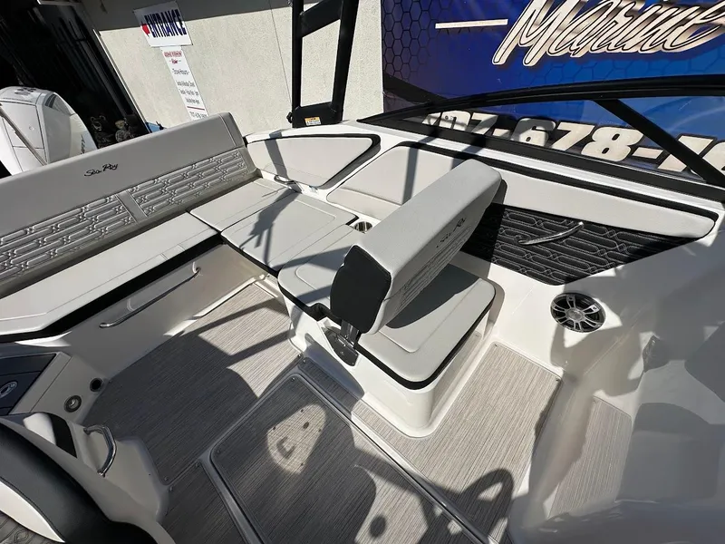 Slide: The Image of 2024 Sea Ray SPX 210 OB boat interior with modern seating and sleek design. - 11