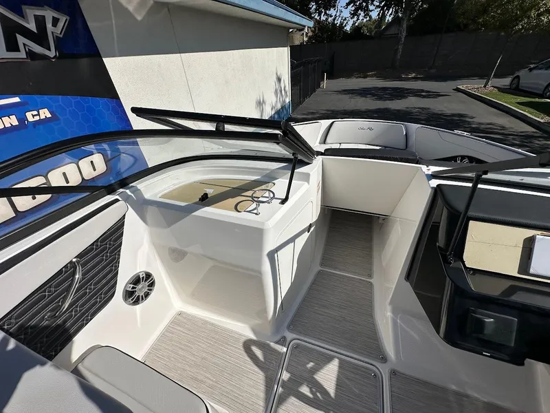 Slide: The Image of 2024 Sea Ray SPX 210 OB boat interior with seating and dashboard. - 13