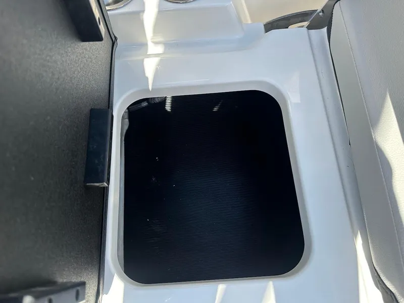 Slide: The Image of 2024 Sea Ray SPX 210 OB boat storage compartment, open and empty. - 22
