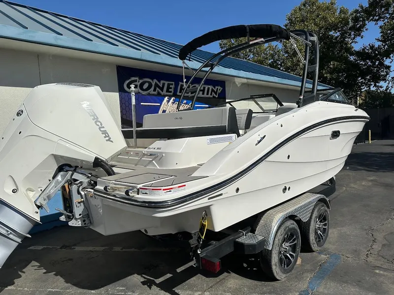 Slide: The Image of 2024 Sea Ray SPX 210 OB boat on trailer, parked outdoors. - 3