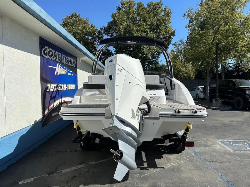 Slide: The Image of 2024 Sea Ray SPX 210 OB boat displayed outdoors, rear view. - 4