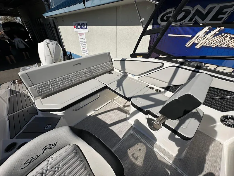 Slide: The Image of 2024 Sea Ray SPX 210 OB boat interior with seating and helm. - 8