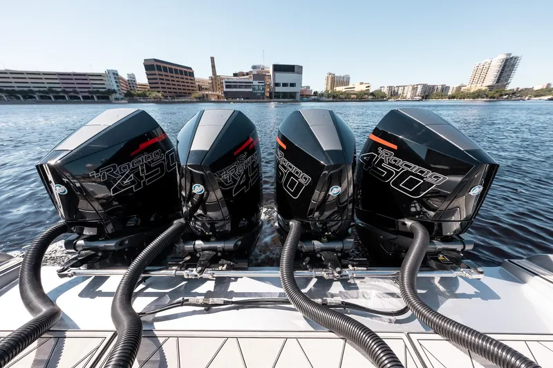 Slide: The Image of 2022 Cigarette 41 Nighthawk with four powerful outboard engines on the water. - 14