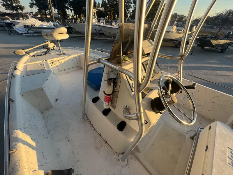 Slide: The Image of 1999 Sprint Pro Master 22 CC boat interior with steering wheel and navigation equipment. - 11