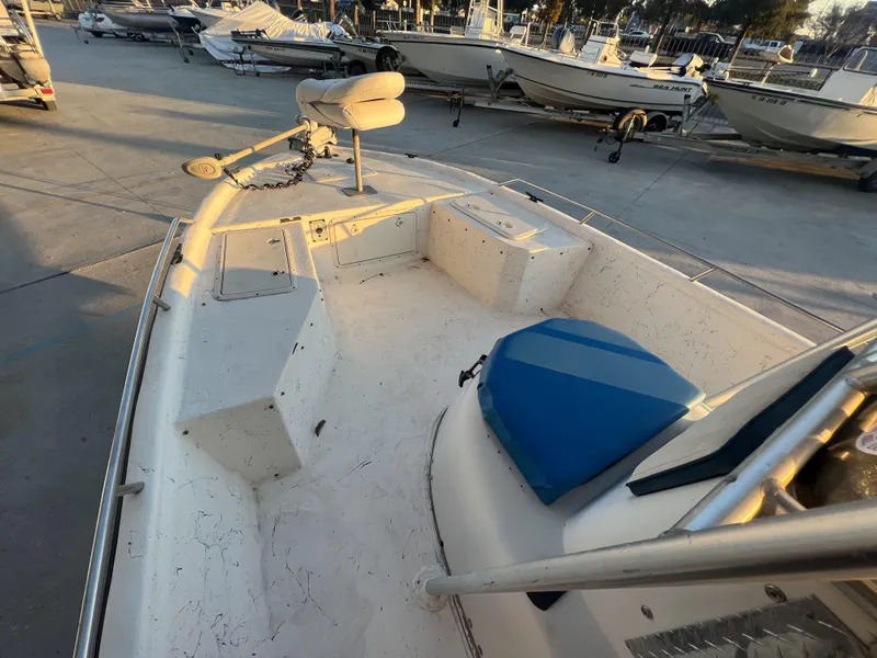 Slide: The Image of 1999 Sprint Pro Master 22 CC boat interior with seating and storage compartments. - 12