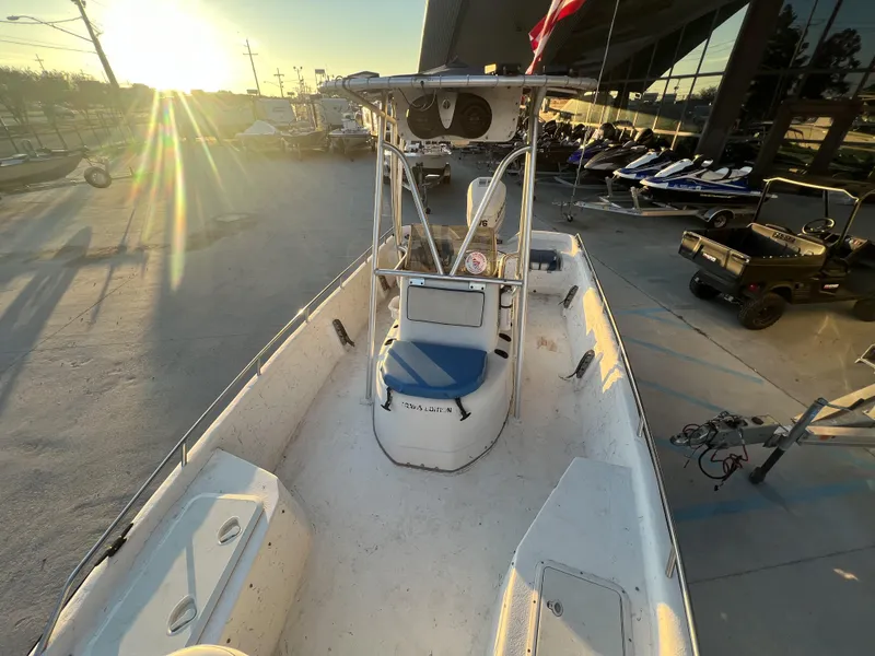 Slide: The Image of 1999 Sprint Pro Master 22 CC boat at a marina during sunset. - 14