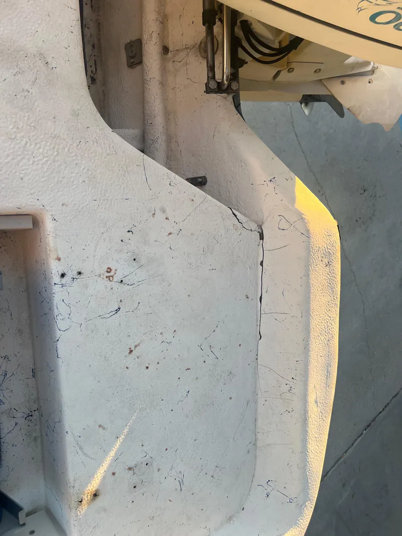 Slide: The Image of Close-up of a 1999 Sprint Pro Master 22 CC boat's worn and cracked surface. - 15