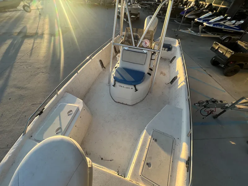 Slide: The Image of 1999 Sprint Pro Master 22 CC boat interior with console and seating. - 7