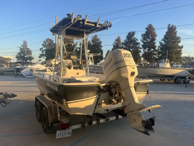 Slide: The Image of 1999 Sprint Pro Master 22 CC boat with Johnson 200 outboard motor on trailer. - 8