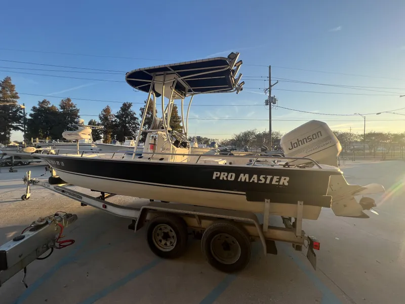 Slide: The Image of 1999 Sprint Pro Master 22 CC boat on trailer with Johnson outboard motor. - 9