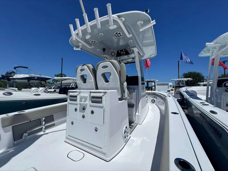 Slide: The Image of 2024 Sportsman 267 Masters OE center console boat with dual seats and rod holders. - 4