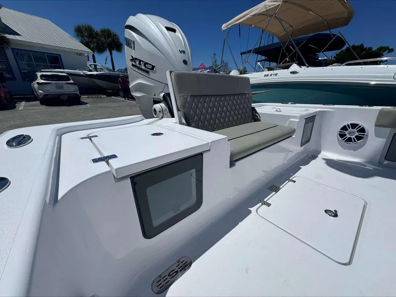 Slide: The Image of 2024 Sportsman 267 Masters OE boat with Yamaha V8 engine, docked at a marina. - 6