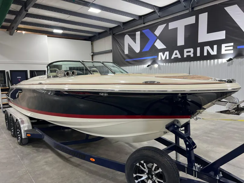 Slide: The Image of 2023 Chris-Craft Launch 27 boat displayed indoors at NXTLY Marine showroom. - 10