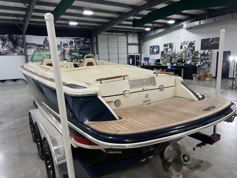 Slide: The Image of 2023 Chris-Craft Launch 27 boat in showroom, showcasing elegant design and craftsmanship. - 17