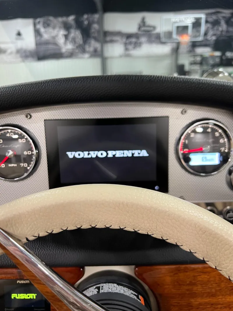 Slide: The Image of Dashboard of 2023 Chris-Craft Launch 27 with Volvo Penta display and gauges. - 19