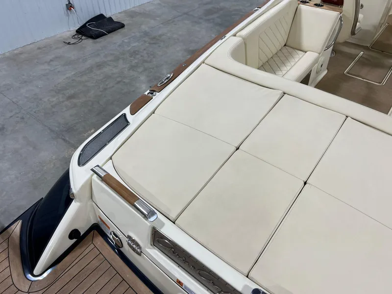 Slide: The Image of 2023 Chris-Craft Launch 27 boat with luxurious beige seating and wooden accents. - 20