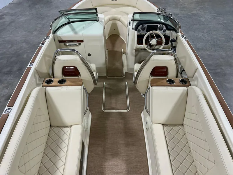 Slide: The Image of 2023 Chris-Craft Launch 27 interior with luxurious seating and elegant dashboard design. - 26