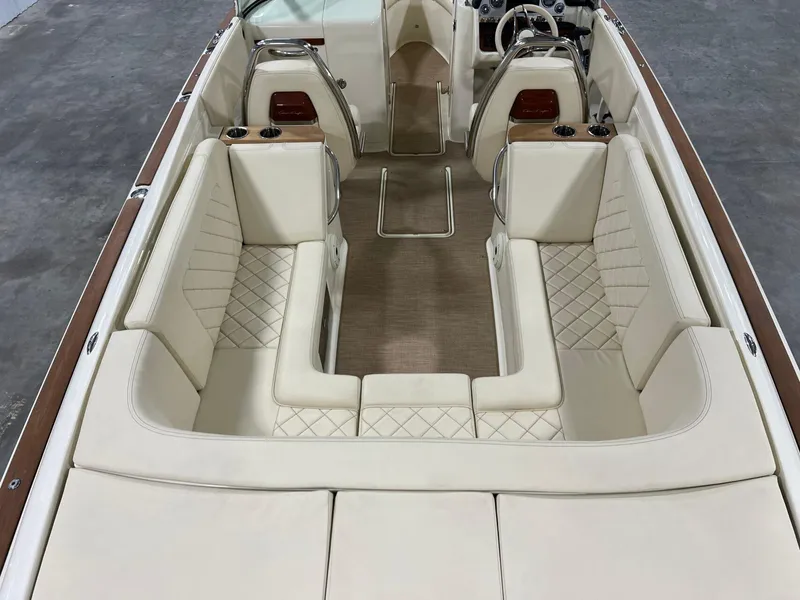 Slide: The Image of 2023 Chris-Craft Launch 27 interior with luxurious cream seating and elegant design. - 27