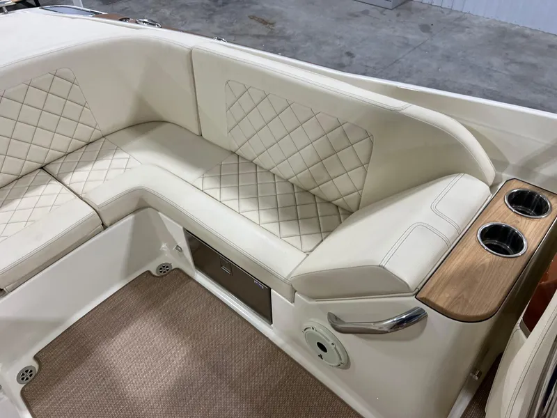 Slide: The Image of Luxurious interior of 2023 Chris-Craft Launch 27 boat with quilted seating and cup holders. - 29