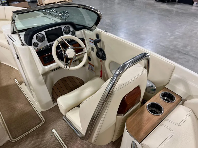 Slide: The Image of 2023 Chris-Craft Launch 27 cockpit with luxurious steering and dashboard details. - 32