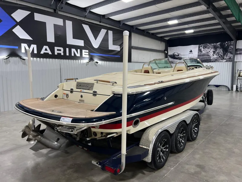 Slide: The Image of 2023 Chris-Craft Launch 27 boat on trailer in indoor showroom. - 4