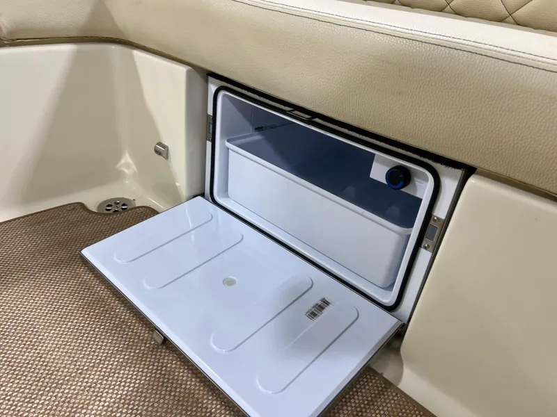 Slide: The Image of 2023 Chris-Craft Launch 27 interior with open storage compartment. - 40