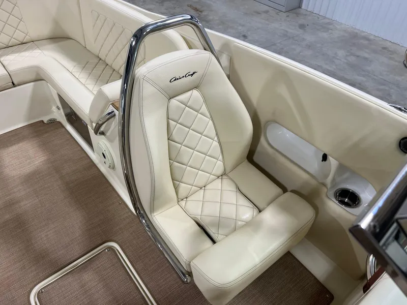 Slide: The Image of 2023 Chris-Craft Launch 27 interior with beige quilted seating and chrome accents. - 41