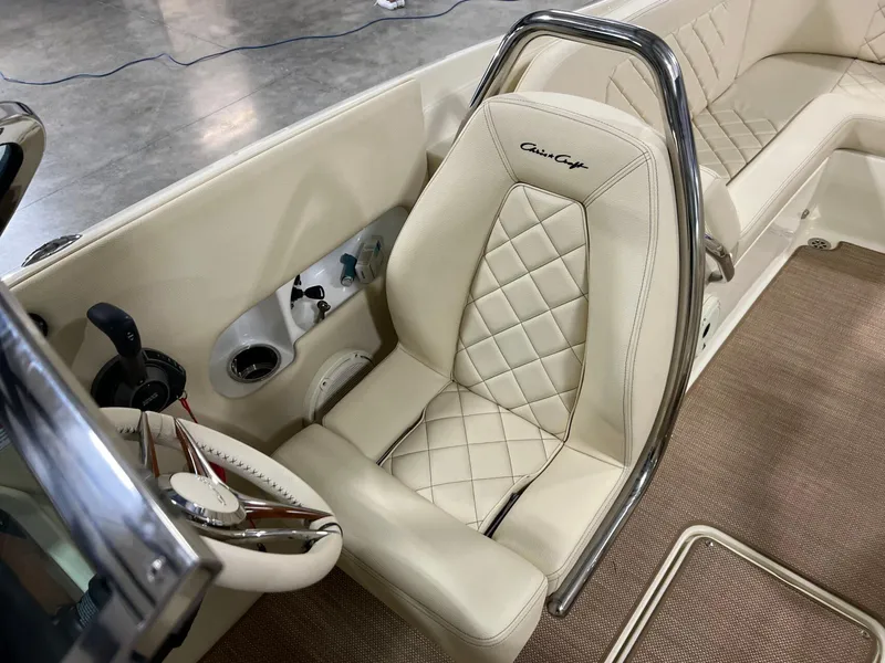 Slide: The Image of 2023 Chris-Craft Launch 27 interior with luxurious cream leather seating and chrome accents. - 42