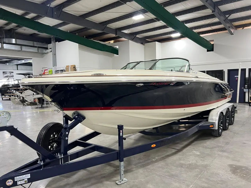 Slide: The Image of 2023 Chris-Craft Launch 27 boat on trailer in indoor showroom. - 6