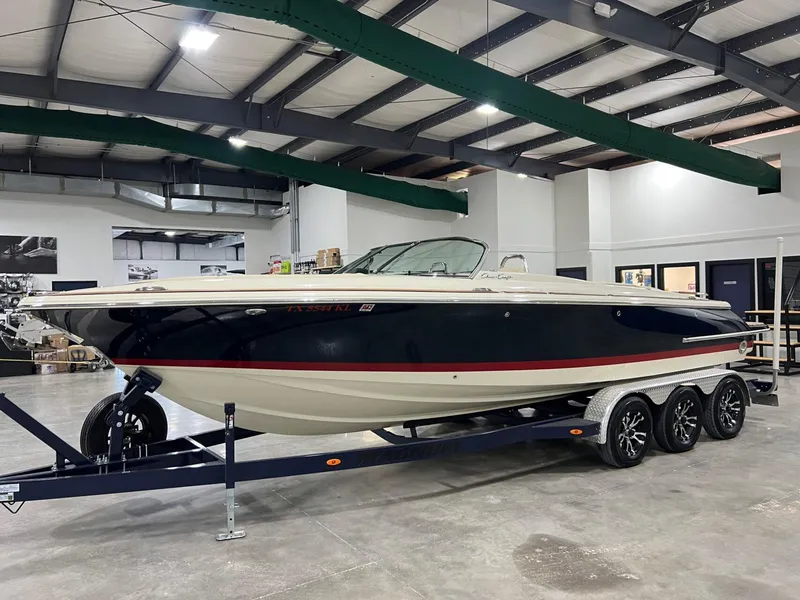 Slide: The Image of 2023 Chris-Craft Launch 27 boat on trailer in indoor showroom. - 8