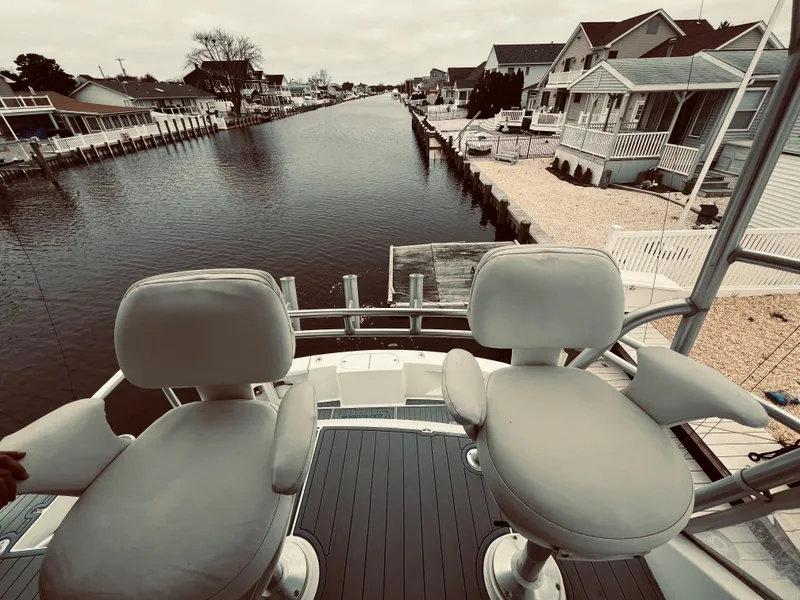 Slide: The Image of View from the deck of a 2002 Egg Harbor 42 Sport Fish boat on a canal. - 15