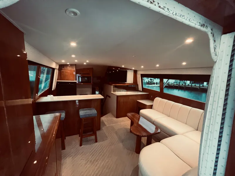 Slide: The Image of Interior of 2002 Egg Harbor 42 Sport Fish yacht with modern furnishings and ample seating. - 16