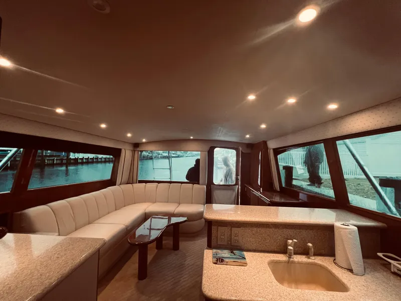 Slide: The Image of Luxurious interior of 2002 Egg Harbor 42 Sport Fish yacht with spacious seating and modern amenities. - 17