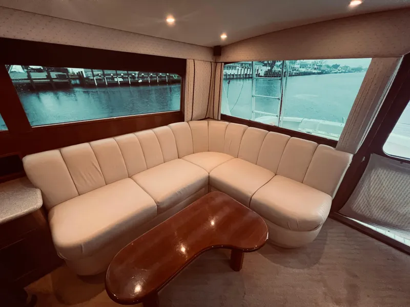 Slide: The Image of Luxurious interior of 2002 Egg Harbor 42 Sport Fish yacht with cream leather sofa. - 19