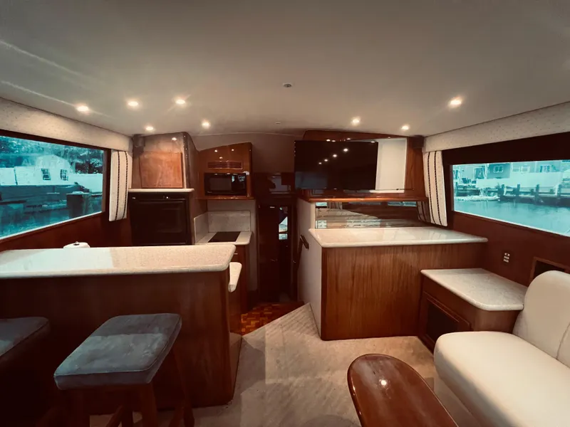 Slide: The Image of Interior of 2002 Egg Harbor 42 Sport Fish yacht with modern kitchen and seating area. - 21