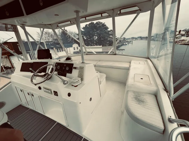 Slide: The Image of 2002 Egg Harbor 42 Sport Fish boat helm with panoramic water view. - 4