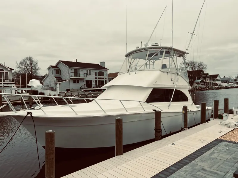 Slide: The Image of 2002 Egg Harbor 42 Sport Fish yacht docked in a residential marina. - 9